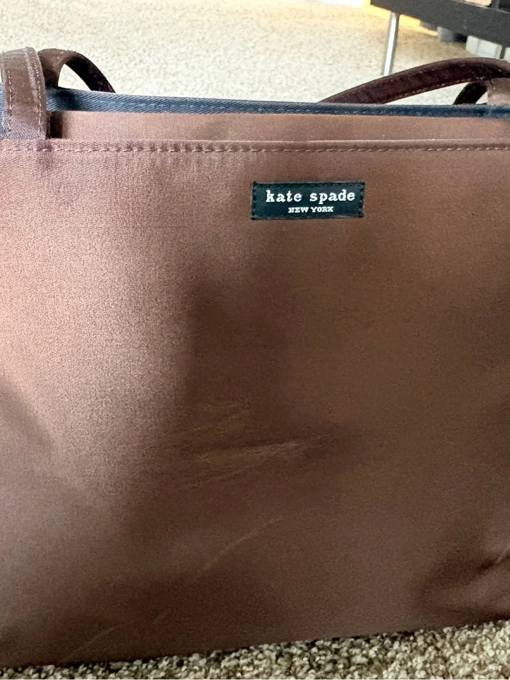 kate spade brown tote with black logo patch